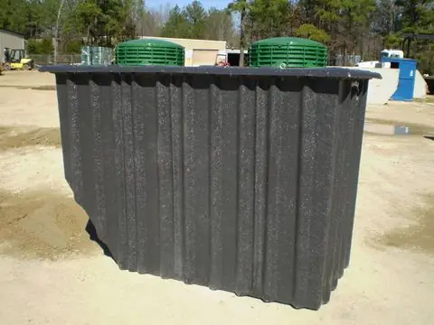 AquaKlear fiberglass treatment tank with green lids